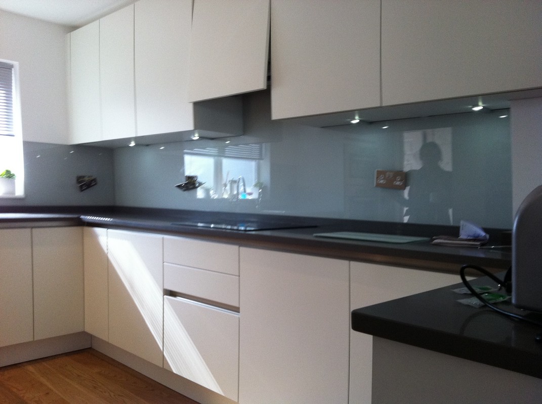 Grey glass kitchen splashback with LED lighting in Enfield