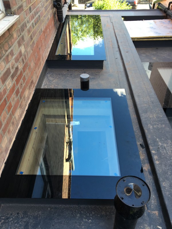 Multiple flat roof skylights on extension in Enfield